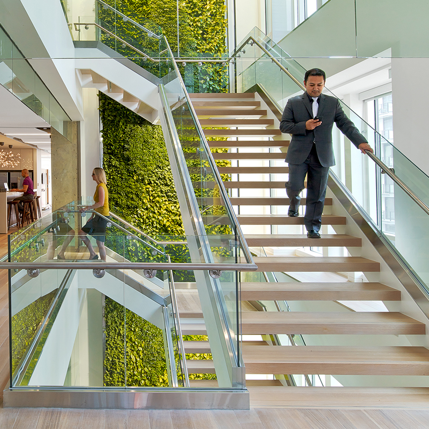 Man walking down stairs in office